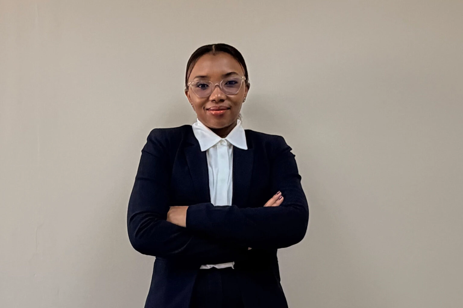 SAFLog Director Yolanda Maqungo standing with her arms folded against a plain wall.